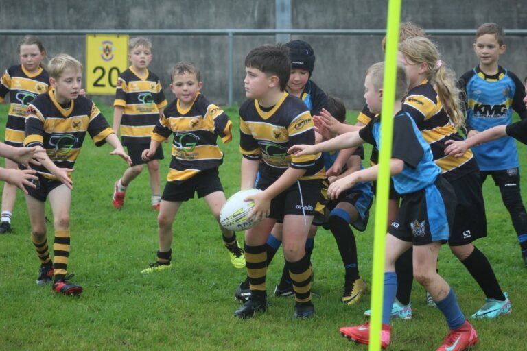 Junior players contesting the ball near the twenty metre line