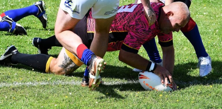 Players competing for a loose ball on the ground