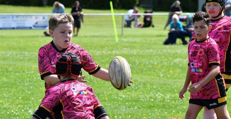 Aspatria Hornets juniors in the pink kit during a match
