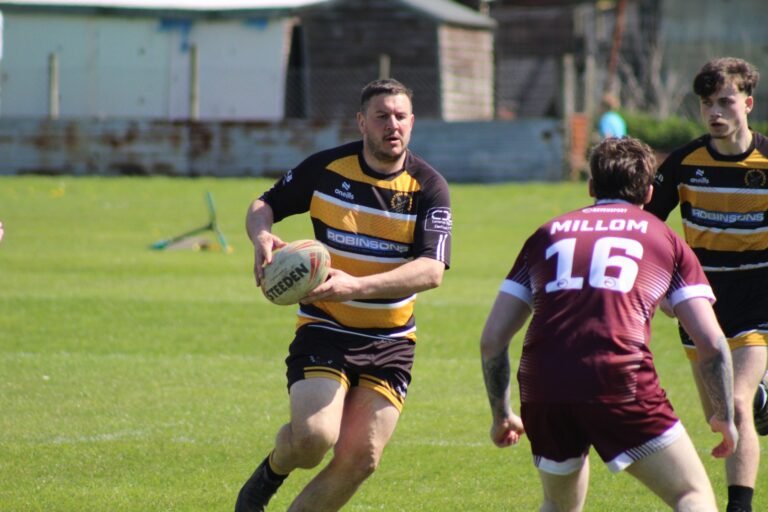 An Aspatria Hornets forward carrying the ball against Millom