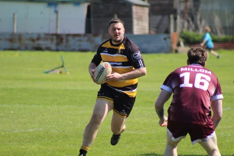 An Aspatria Hornets forward taking the ball into the Millom defence