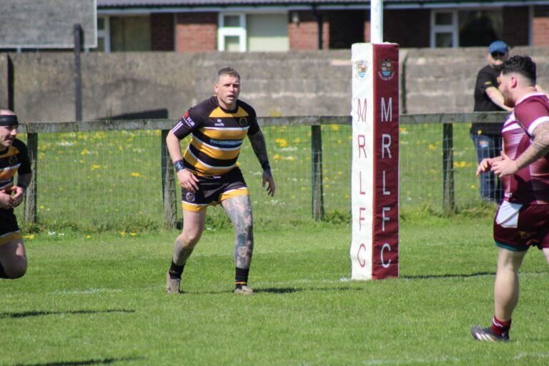 Play moving upfield during the game against Millom