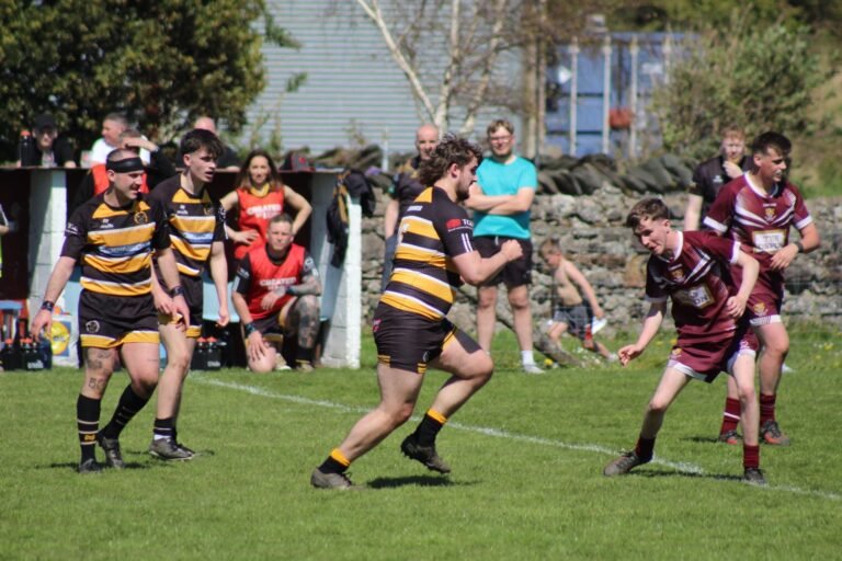 Aspatria Hornets and Millom players spread across the pitch