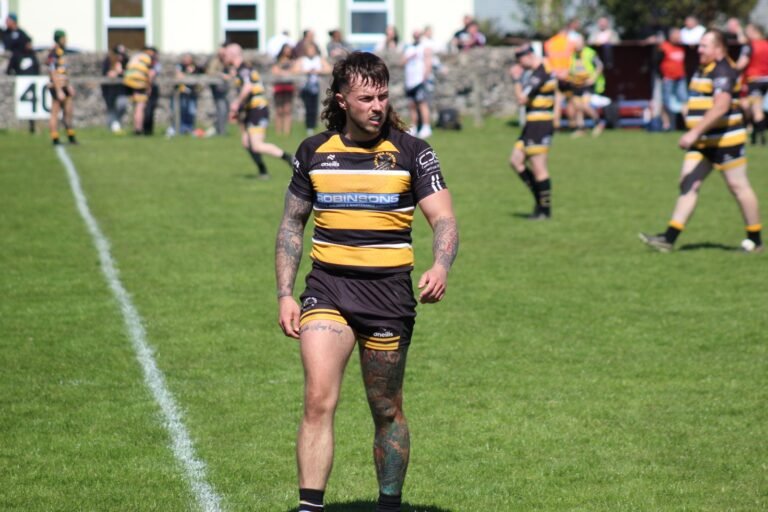 An Aspatria Hornets forward standing over the ball at the play the ball