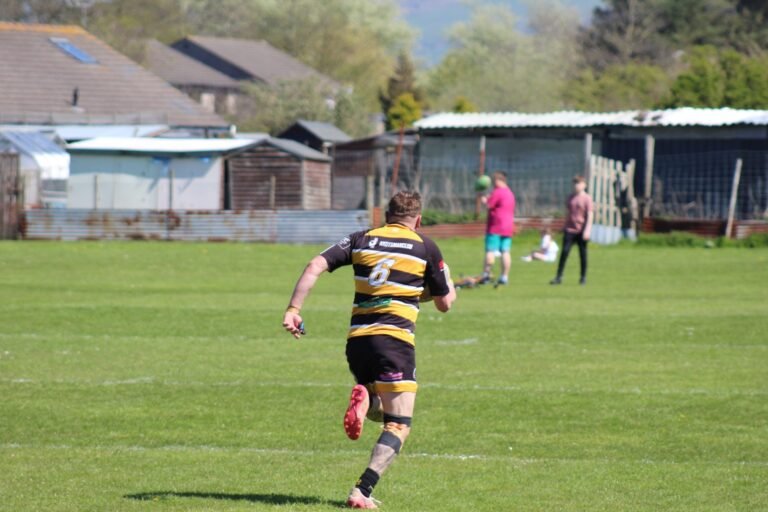 An Aspatria Hornets player running down the touchline